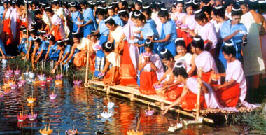 On Loy Krathong day, waterways are filled with beautifully-made lotus-shaped vessels launched by people to honor the Goddess of Water